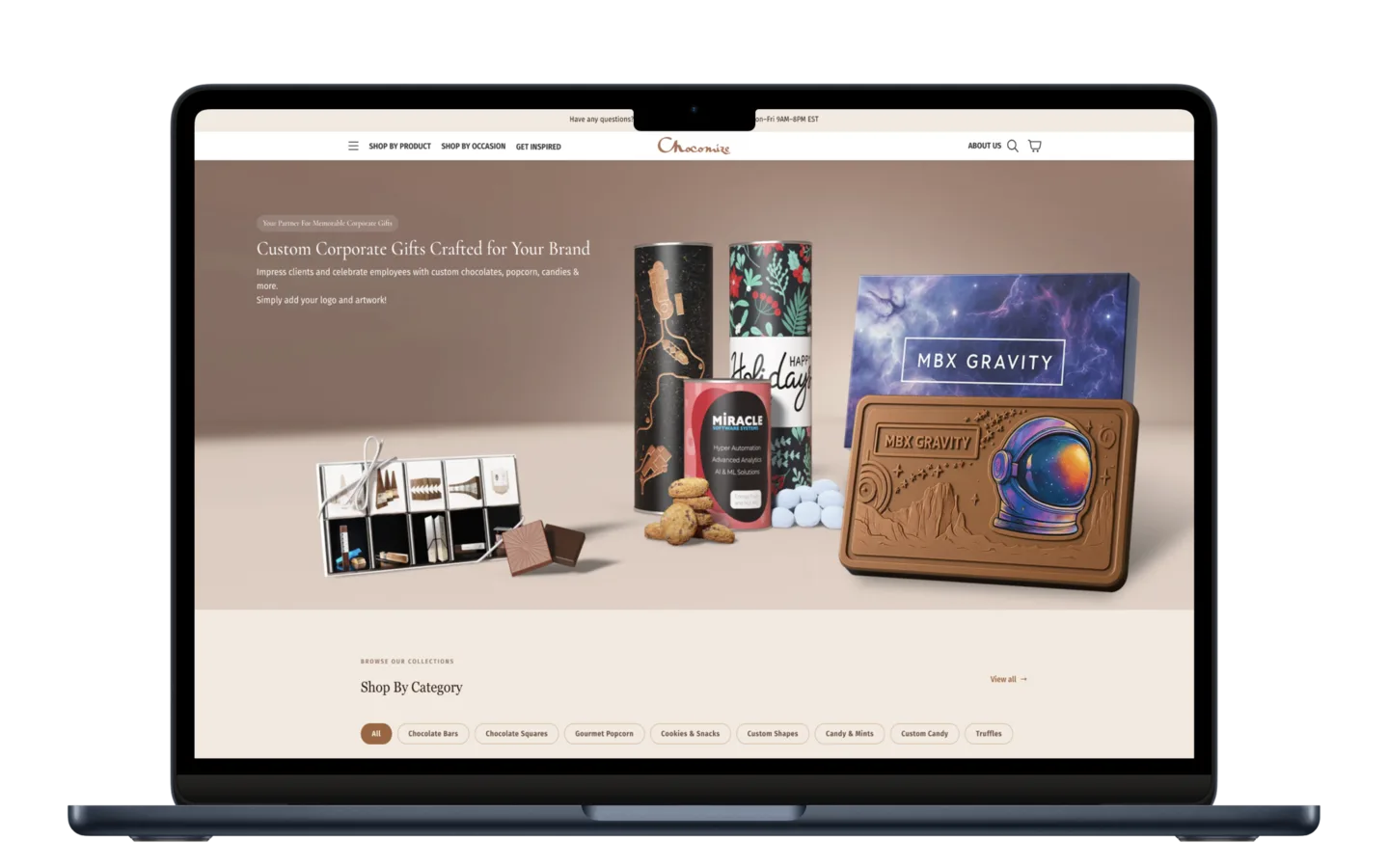 Chocomize Shopify store on a laptop: "Custom corporate gifts crafted for your brand", with branded chocolate bars, tins, and gift boxes